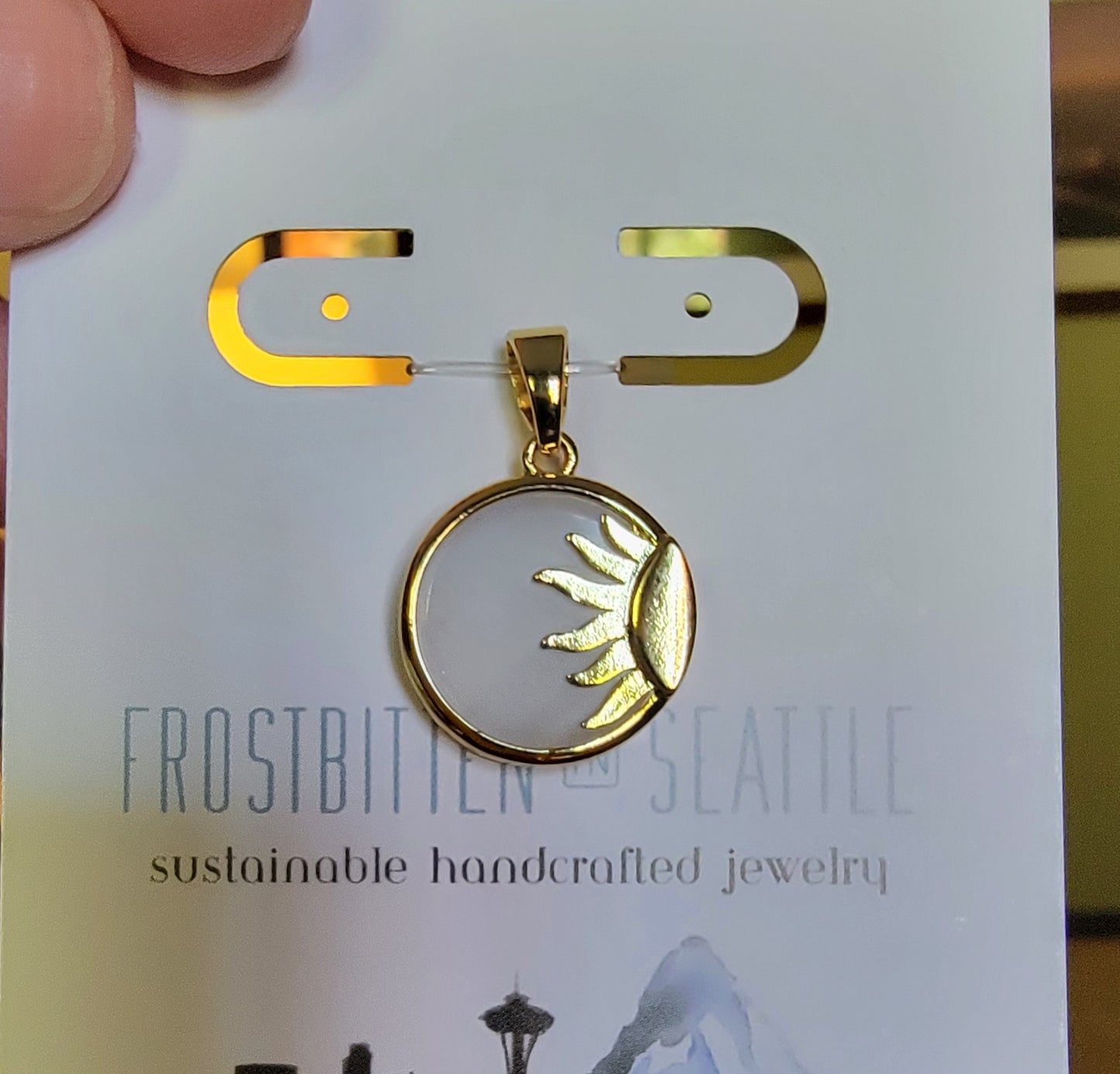 White resin, 14k gold-plated, & 14k gold-filled sun pendant